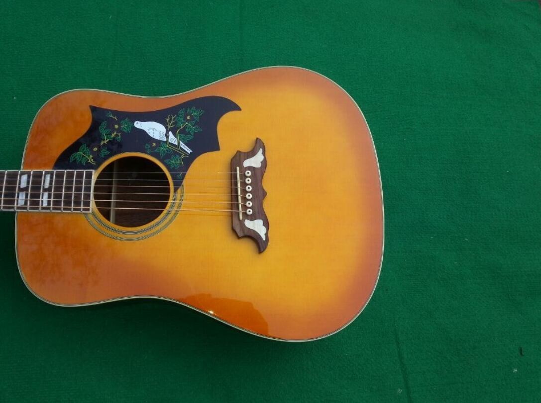2018 Orange Sunburst Dovo acoustic guitar