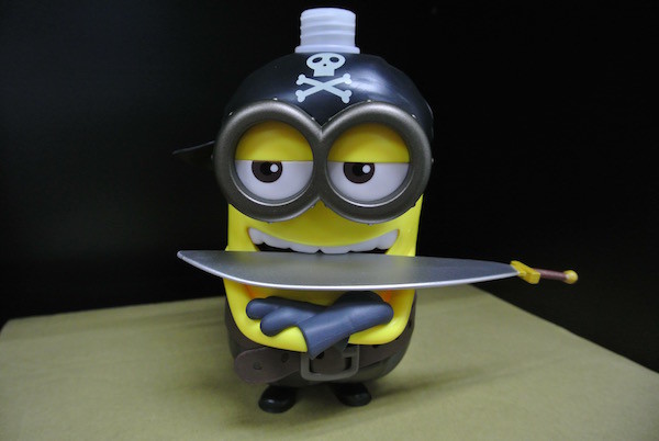 Yellow Color Cartoon Shampoo Bottle Have Sword With Universal Studios Logo
