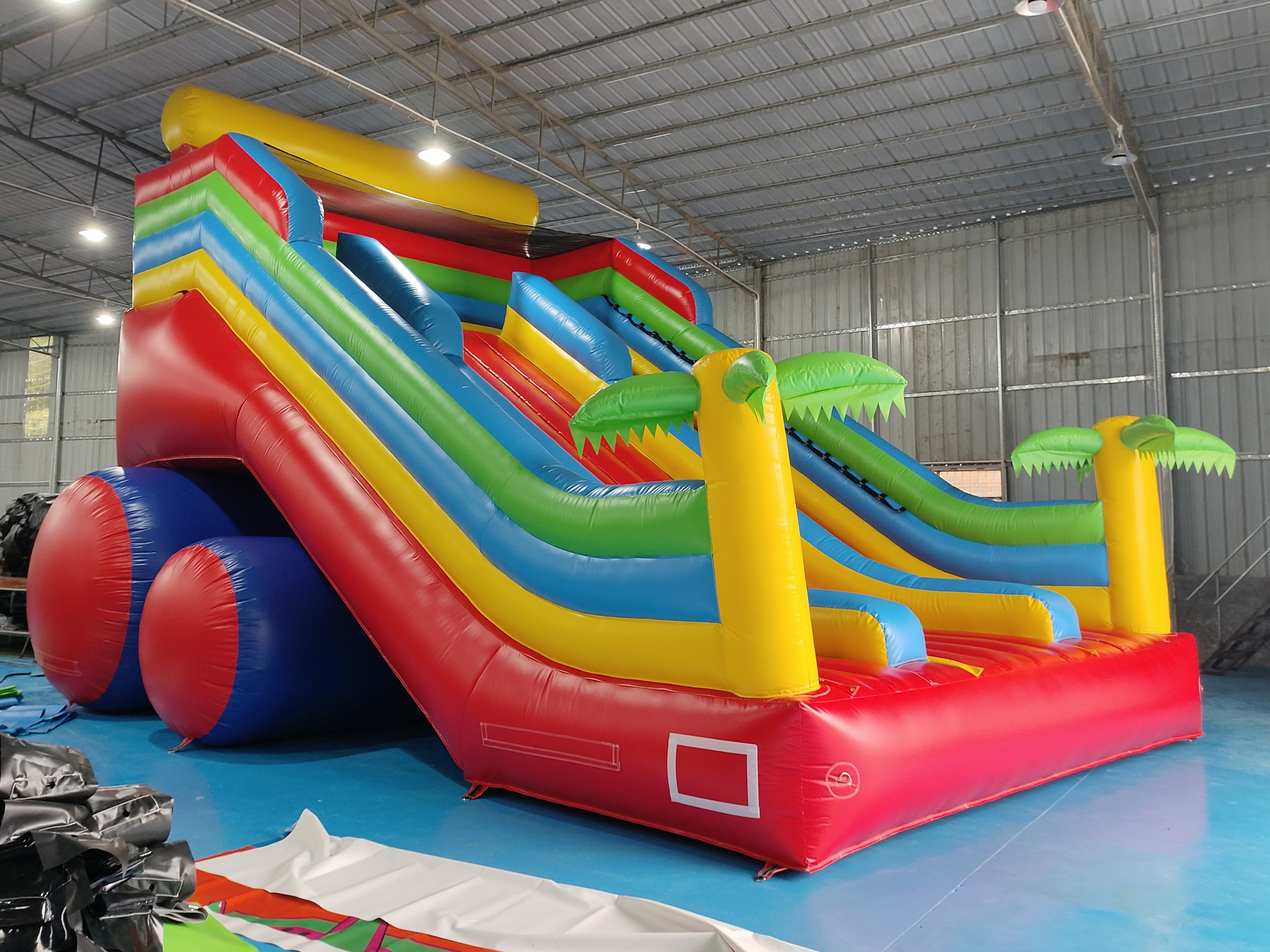 New Design Tarpaulin Fireproof Commercial Inflatable High Slide Palm Theme Giant Inflatable Slide Castle For Kids And Ad
