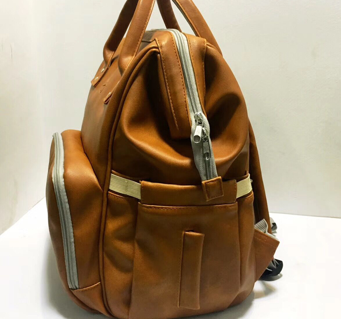 Brown PU Leather Baby Bag Backpack , Unisex Maternity Diaper Bags For Mom And Dad