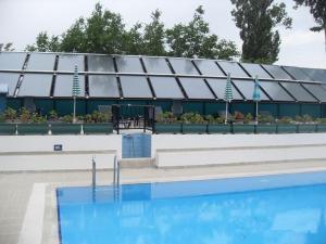 Flat plate solar collector for swimming pool heating